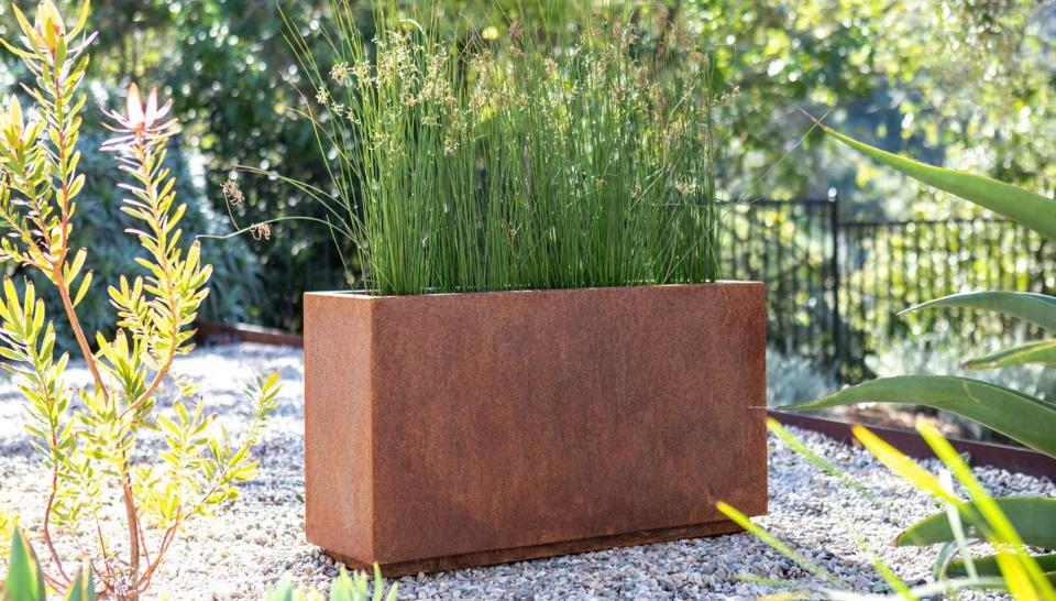 Add a few planters to your garden for some extra greenery.