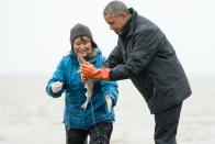 <p>President Barack Obama reacts as a fish he is holding releases milt, the sperm-containing fluid of a male fish, while visiting with Commercial and Subsistence Fisher Kim Williams on Kanakanak Beach, Wednesday, Sept. 2, 2015, in Dillingham, Alaska. Obama is on a historic three-day trip to Alaska aimed at showing solidarity with a state often overlooked by Washington, while using its glorious but changing landscape as an urgent call to action on climate change. (AP Photo/Andrew Harnik) </p>