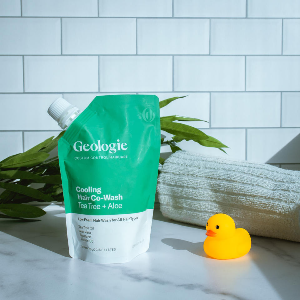 geologie shampoo on marble with tile background with rubber duckie