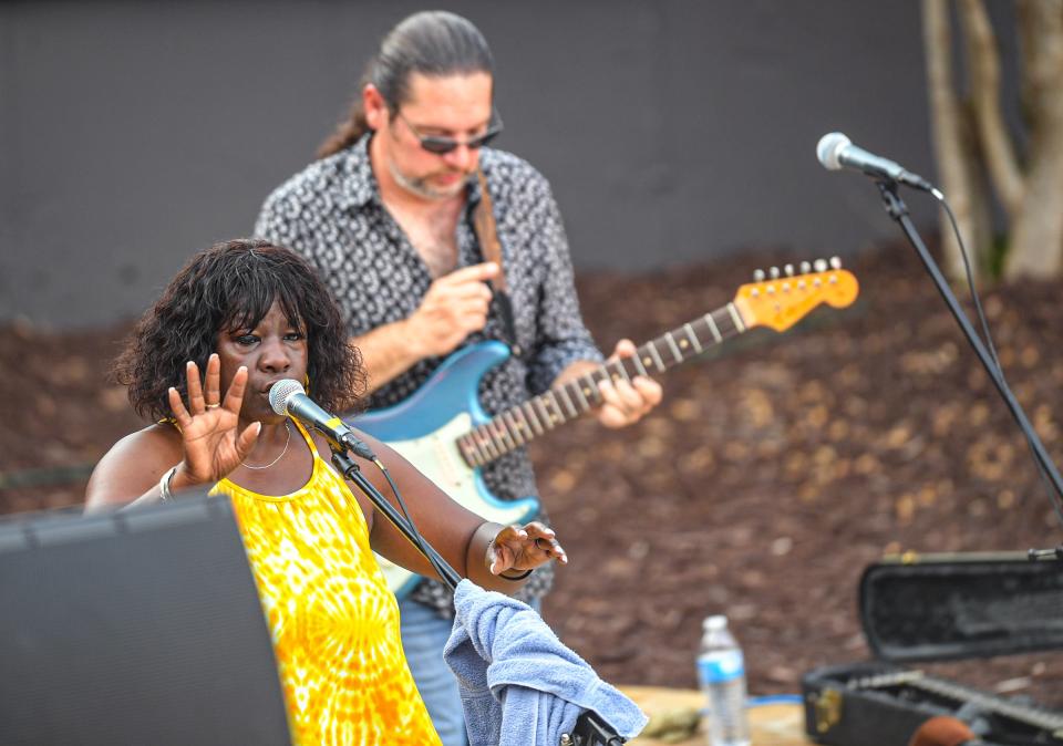 People cool off in the fountain water zone of Carolina Wren Park during The Piedmont Natural Gas Main Street Program Block Party with Wanda Johnson of Anderson, Thursday, July 29, 2021.