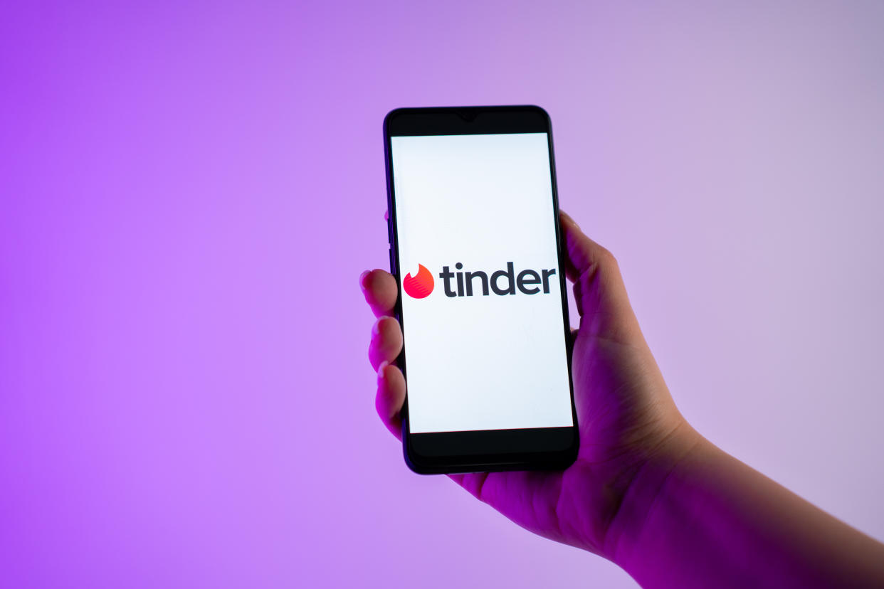 A person is holding a mobile phone with the Tinder dating app logo on its screen, in Athens, Greece, on 31 January 2024. (Photo by Nikos Pekiaridis/NurPhoto via Getty Images)