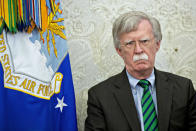 Picture the scene: John Bolton stands proudly against a backdrop of an