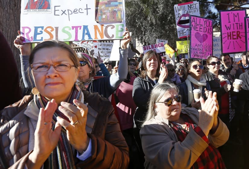 Demonstrators applaud speakers in support of the Women's March on Washington at the Arizona Capitol Saturday, Jan. 21, 2017, in Phoenix. Thousands of protesters in Phoenix joined in support of those in cities around the globe protesting against Donald Trump as the new United States president. (AP Photo/Ross D. Franklin)