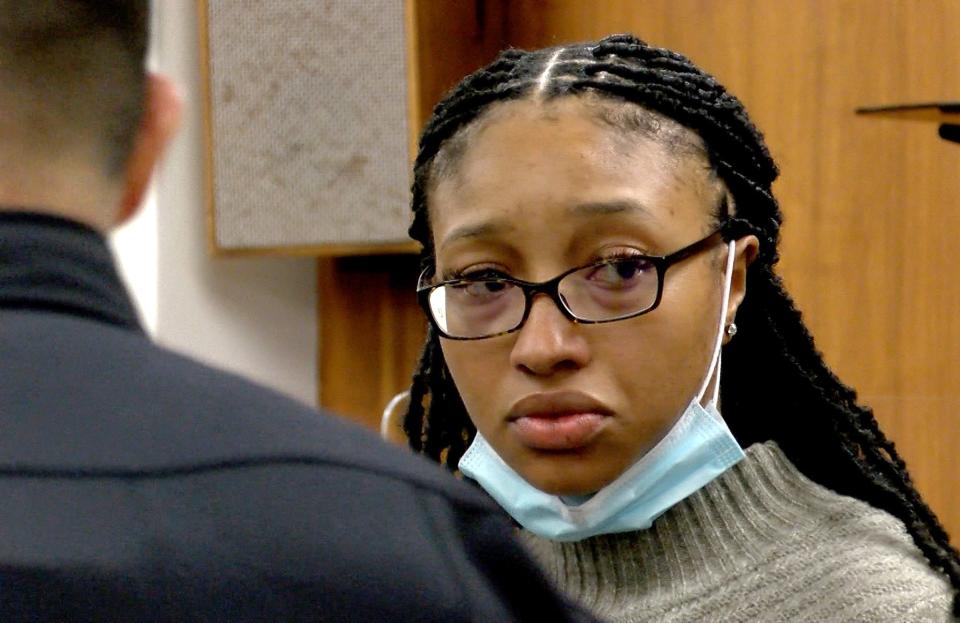 Monique Moore watches a witness enter the courtroom during her trial Tuesday, March 15, 2022, in State Superior Court in Freehold.   Moore is on trial before Judge Jill O'Malley for the 2016 stabbing murder in Neptune of Joseph Wilson, Jr. 