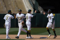 Oakland Athletics right fielder Lawrence Butler, right, celebrates with second baseman Zack Gelof (20) after their victory over the Washington Nationals in a baseball game Sunday, April 14, 2024, in Oakland, Calif. (AP Photo/Godofredo A. Vásquez)