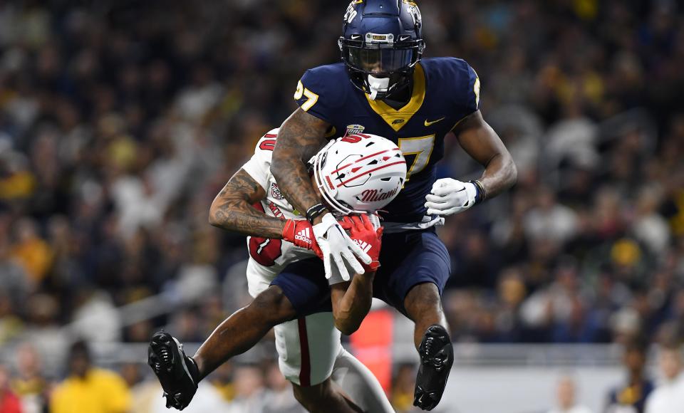 Dec 2, 2023; Detroit, MI, USA; Toledo Rockets cornerback Quinyon Mitchell (27) breaks up a pass intended for Miami (OH) Redhawks wide receiver Gage Larvadain (10) in the third quarter at Ford Field. Mandatory Credit: Lon Horwedel-USA TODAY Sports