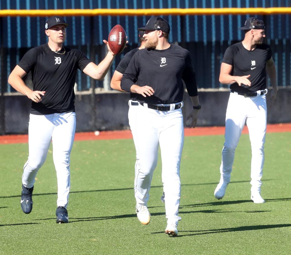 Detroit Tigers pitchers and catchers went through drills and a bullpen session during Spring Training Tuesday, February 14, 2023. Pitchers Will Vest and Tarik Skull toss the NFL football around as they jog during practice the ball was donated by the Detroit Lions.