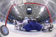 <p>The puck shot by Mark Arcobello (26), of the United States, sails past goalie Jan Laco (50), of Slovakia, during the second period of the qualification round of the men’s hockey game at the 2018 Winter Olympics in Gangneung, South Korea, Tuesday, Feb. 20, 2018. (Bruce Bennet/Pool Photo via AP) </p>