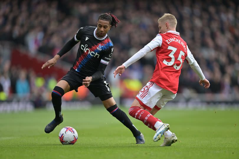 Michael Olise takes on Arsenal defender Oleksandr Zinchenko for Crystal Palace