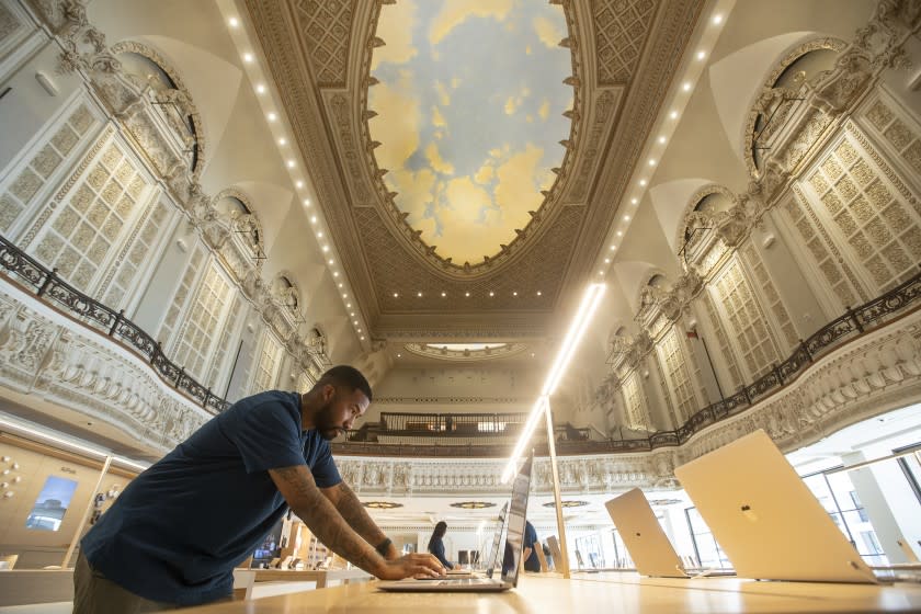 LOS ANGELES, CA - JUNE 23, 2021: 7 WillIams, a creative for Apple, works inside the Apple Tower Theatre on Broadway in downtown Los Angeles that is ready to open after a three-year renovation and conversion of the historic Tower Theater, built in 1927, the first movie palace in Los Angeles to be equipped for talkies. View above shows a portion of the atmospheric dome ceiling. (7 is his actual first name) (Mel Melcon / Los Angeles Times)