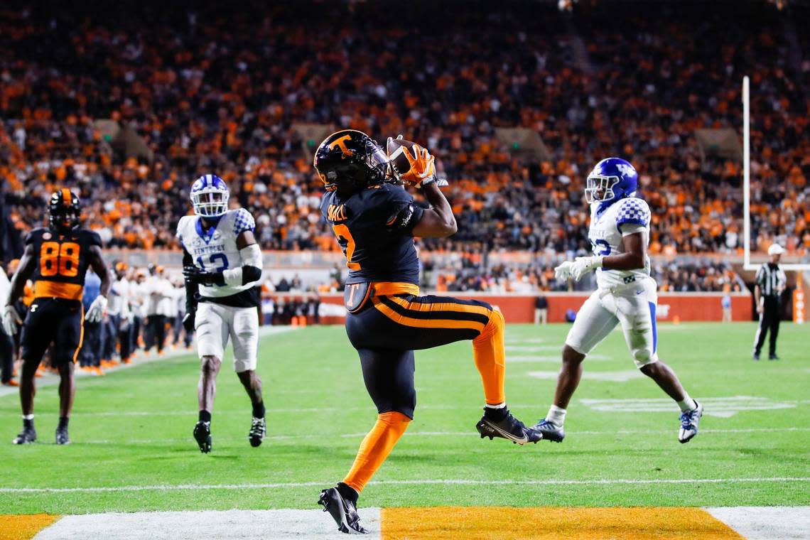 Tennessee’s Jabari Small makes a catch to score a touchdown against Kentucky on Saturday night. Small ran for 78 yards and caught two passes for 17 yards.