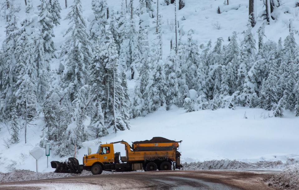 An Oregon Department of Transportation snow plow turns around on Highway 20 east of Springfield Friday Dec. 17, 2021.