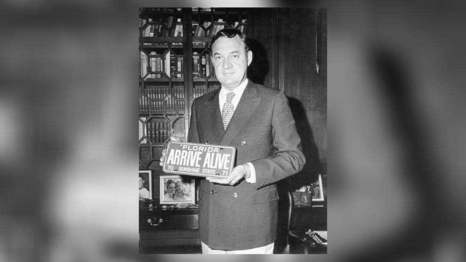 West Palm Beach resident and former Gov. Claude Kirk, shown displaying a vanity automobile license plate in 1970, sued the sugar companies over cane burning in the 1990s.