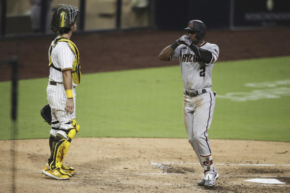 Arizona Diamondbacks' Starling Marte celebrates as he crosses home after hitting a solo home run against the San Diego Padres during the sixth inning of a baseball game Saturday, Aug. 8, 2020, in San Diego. (AP Photo/Derrick Tuskan)