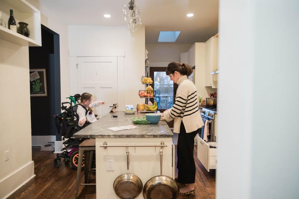Hilary Thomson and her daughter Cora at home in Vancouver. Hilary says a number of parents from schools across the district have raised concerns about staffing levels for workers supporting kids with learning designations and individual education plans.