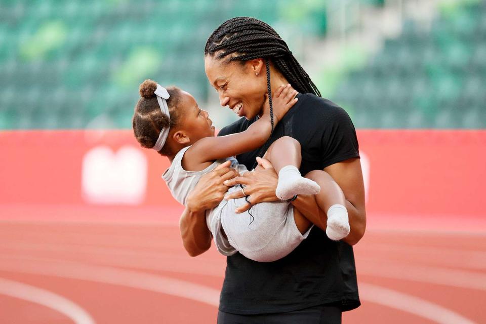 <p>Steph Chambers/Getty</p> Allyson Felix and daughter Camryn