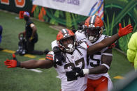 Cleveland Browns' Kareem Hunt (27) celebrates his touchdown with David Njoku (85) during the second half of an NFL football game against the Cincinnati Bengals, Sunday, Oct. 25, 2020, in Cincinnati. (AP Photo/Bryan Woolston)