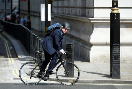 Conservative party MP, Boris Johnson, rides his bike along Whitehall in London, Britain July 6, 2016. REUTERS/Peter Nicholls