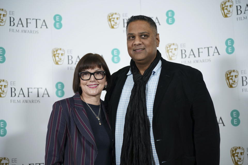 CEO of BAFTA Jane Millichip and Chair of BAFTA Krishnendu Majumdar pose for a photo during the nominations for the BAFTA Film Awards 2023, at BAFTA's headquarters, in London, Thursday, Jan. 19, 2023. (Yui Mok/PA via AP)