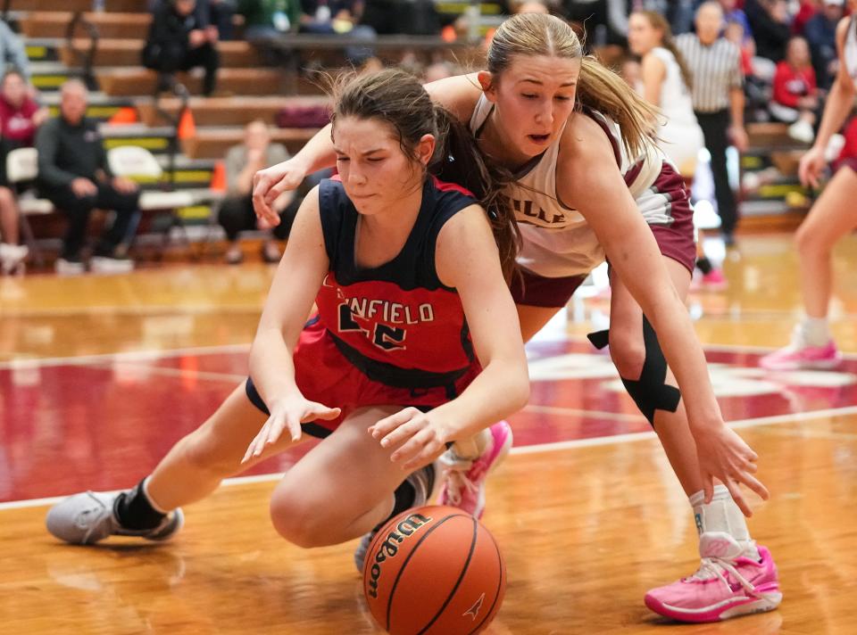Plainfield Quakers guard Hannah Menser (22) rushes after the ball against Danville's guard Emma Ancelet (33) on Saturday, Jan. 6, 2024, during the game at Danville Community High School in Danville.