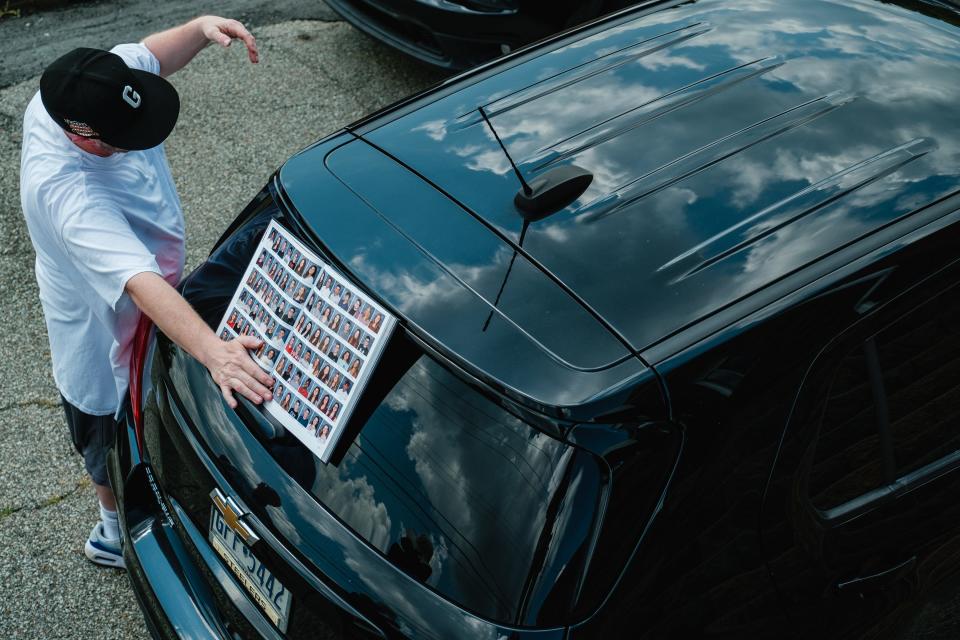 Bill Ranft holds a 2020 yearbook depicting Thomas Matthew Crooks in the Pennsylvania neighborhood where Crooks grew up, Sunday, July 14, 2024.