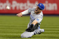 Kansas City Royals left fielder Hunter Dozier (17) dives for a ball hit by New York Yankees Gio Urshela (29) but comes up short during the ninth inning of a baseball game, Tuesday, June 22, 2021, at Yankee Stadium in New York. The Royals defeated the Yankees 6-5. (AP Photo/Kathy Willens)