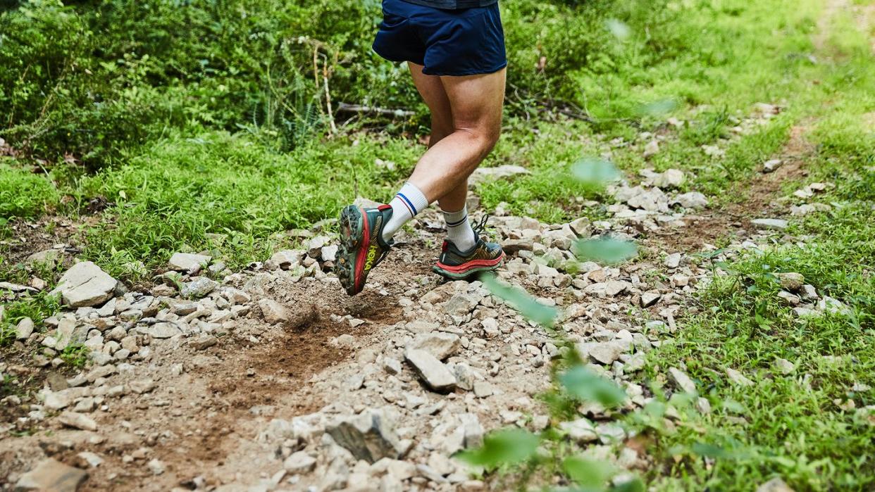 a person running on a trail