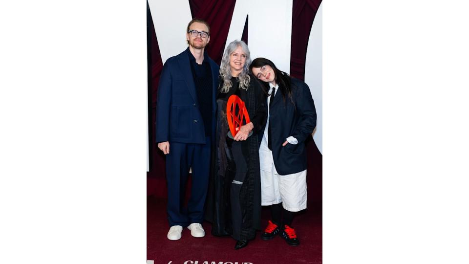 Billie eilish with her brother and mother on the red carpet