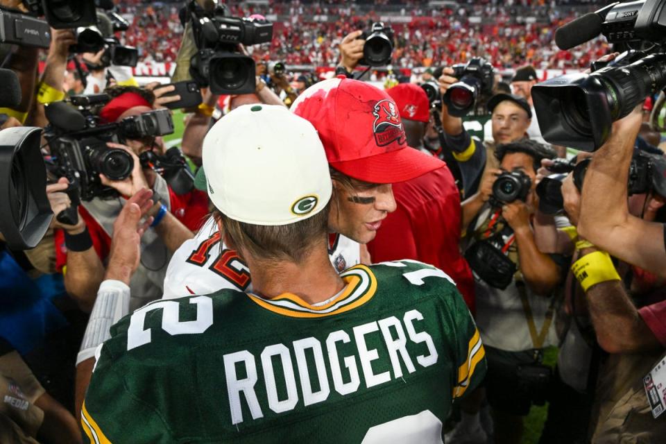 Green Bay Packers’ Aaron Rodgers hugs Tampa Bay Buccaneers’ Tom Brady (Jason Behnken/AP) (AP)