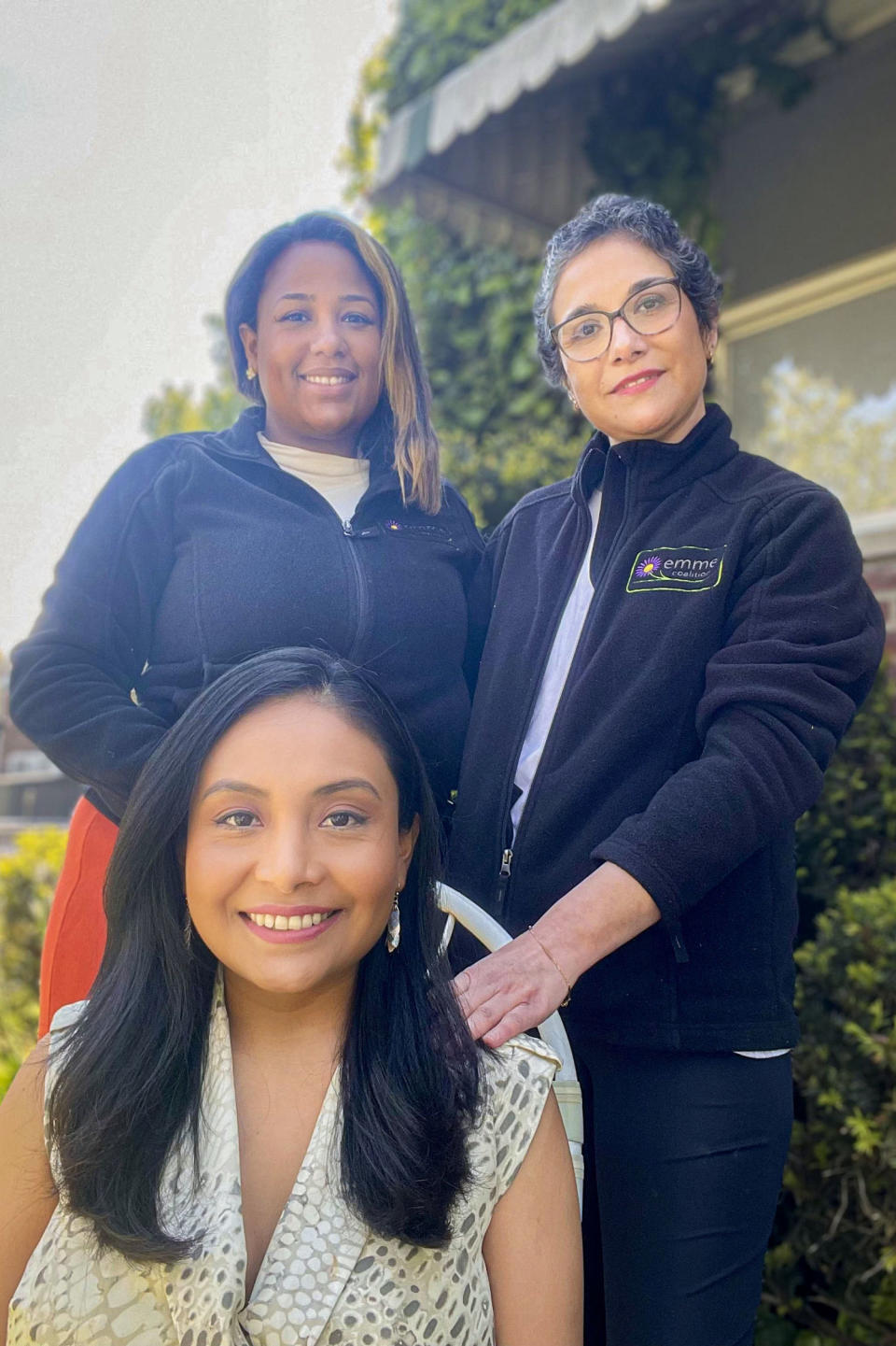 Milagros Aquino, seated, with community health worker Massiel Olivo, left. and Jacqueline Carrizo, a doula who was assigned to her by the Emme Coalition. (Massiel Olivo)