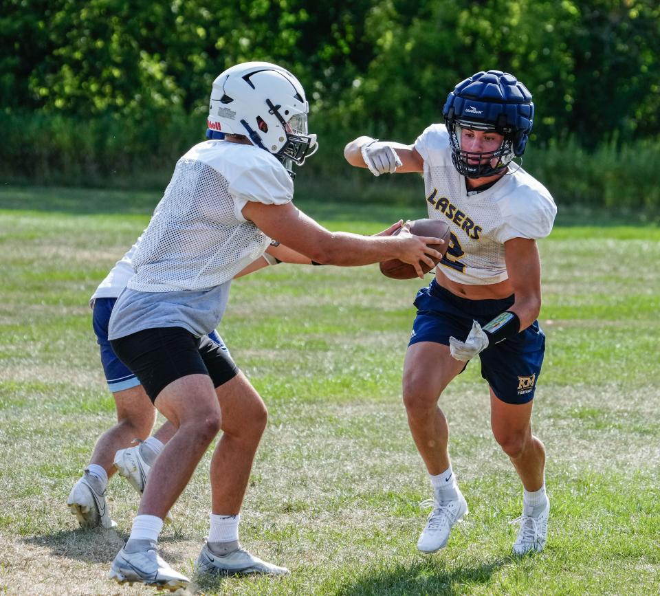 Kettle Moraine's Drew Wagner receives a handoff during a practice on Aug. 7. Wagner, a Navy commit, was a first team all-Classic 8 Conference selection after a 53-catch season that saw him register 1,035 yards and nine touchdowns.