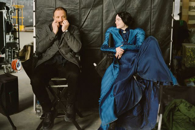 <p>Searchlight Pictures</p> Yorgos Lanthimos and Emma Stone on the set of <em>Poor Things</em> (2023)