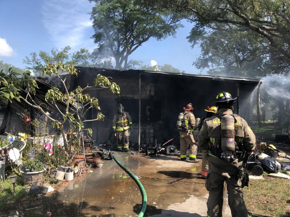 Firefighters battled the house fire on Carew Avenue. 