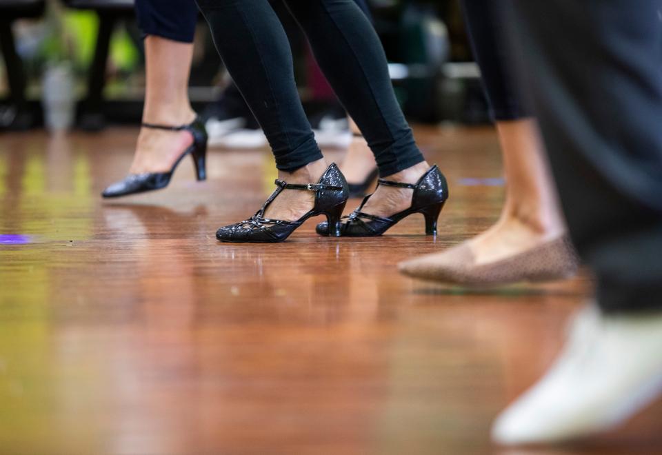 Individuals take a salsa dance class with Miriam Watkins, owner of Studio D, Sunday, April 18, 2021.