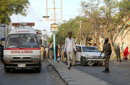 An ambulance arrives as Somali security forces secure the scene of an explosion outside Weheliye Hotel in Maka al Mukarama street in Mogadishu, Somalia March 22, 2018 REUTERS/Feisal Omar