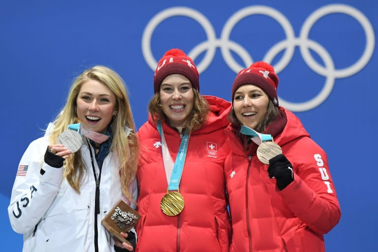 L-R: USA's silver medallist Mikaela Shiffrin, Switzerland's gold medallist Michelle Gisin and Switzerland's bronze medallist Wendy Holdener pose on the podium during the medal ceremony for the alpine skiing women's combined