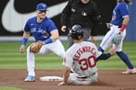Boston Red Sox's Rob Refsnyder (30) is out at second base on an attempted steal with a tag from Toronto Blue Jays' Matt Chapman (26) during the first inning of a baseball game Tuesday, June 28, 2022, in Toronto. (Jon Blacker/The Canadian Press via AP)