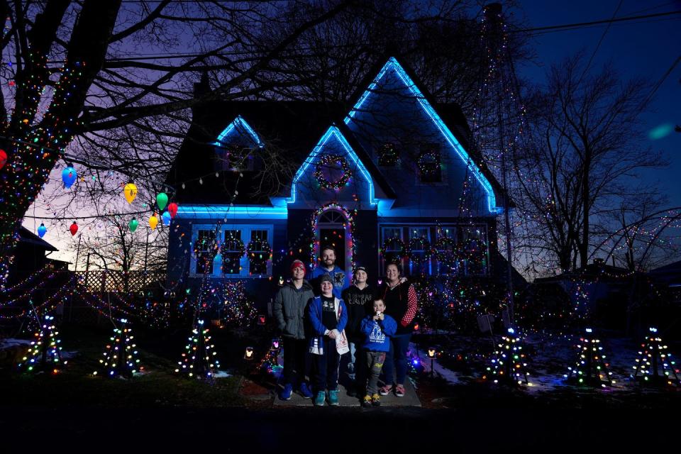 The Giroux family of East Providence with the holiday decorated home on Dec. 13, 2022. Left to right Harrison, Brian (Dad), Jude, Sophie, Flynn and Marsha (Mom).