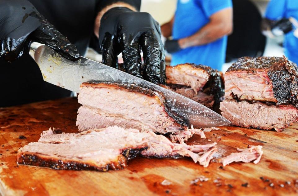 Smoked brisket is freshly sliced at Okeechobee Prime Barbecue in West Palm Beach. The roadside stand has been popping up in Jupiter Farms and plans a longer stay in the area.