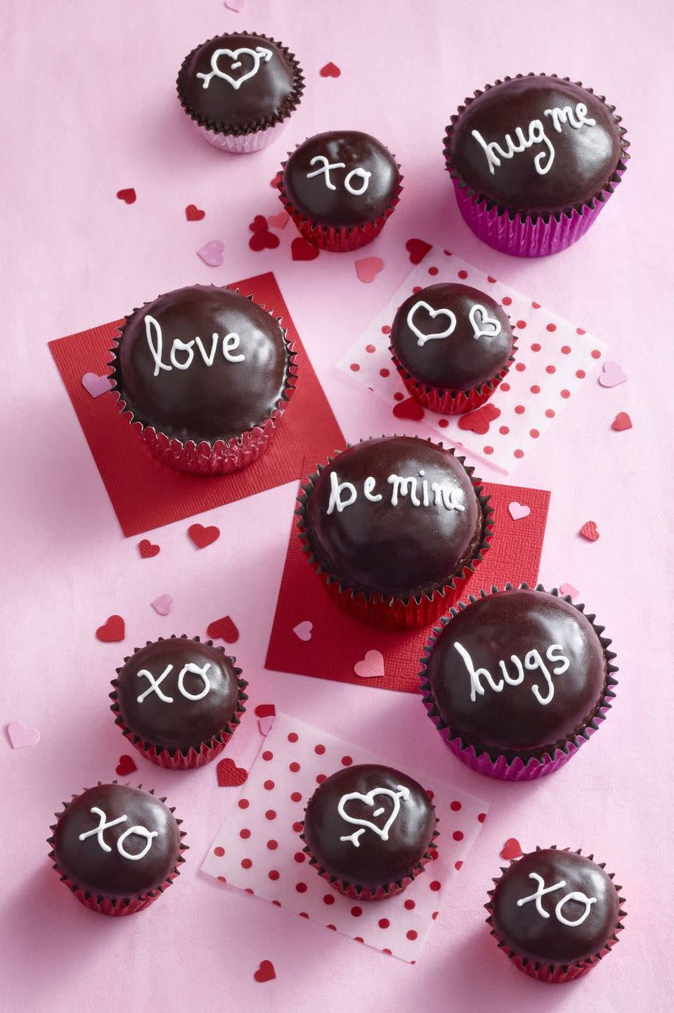 <p>What better way to say "I love you" than with chocolate cupcakes covered in creamy ganache?</p><p><a href="https://www.womansday.com/food-recipes/food-drinks/recipes/a10541/chocolate-cupcakes-121992/" rel="nofollow noopener" target="_blank" data-ylk="slk:Get the Chocolate Sweetheart Cupcakes recipe.;elm:context_link;itc:0;sec:content-canvas" class="link "><em>Get the Chocolate Sweetheart Cupcakes recipe.</em></a></p>