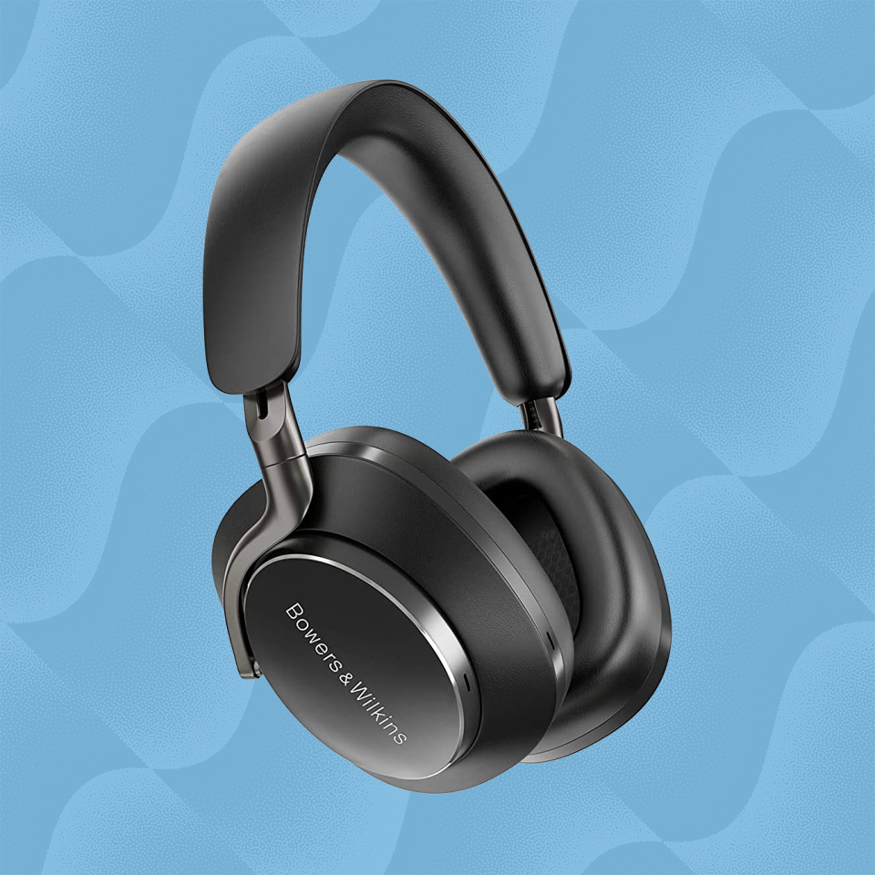 the bowers and wilkins px8 over ear headphones against a wavy blue background