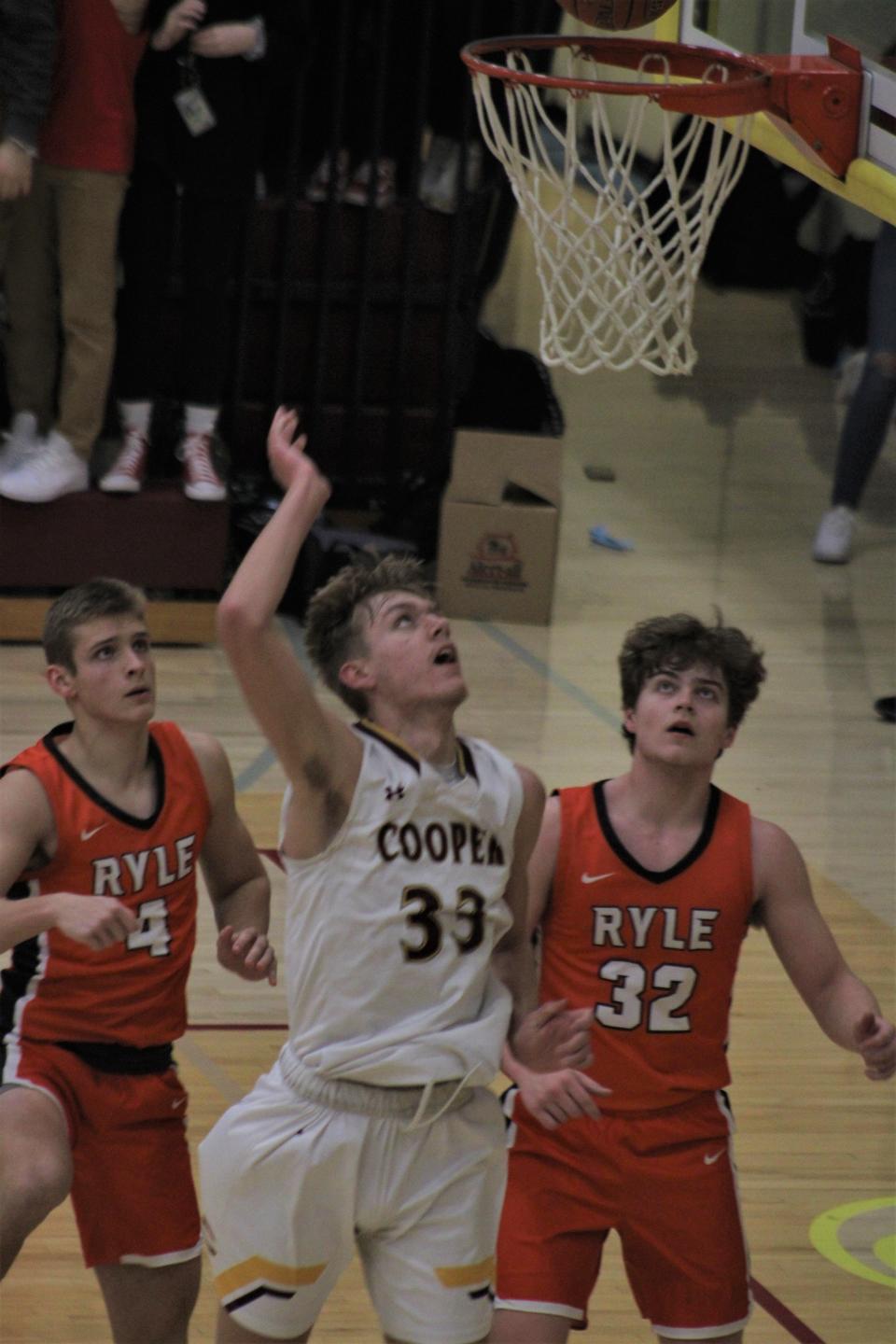 Cooper junior Caleb Brooks watches his shot as Cooper defeated Ryle 52-45 Jan. 21.
