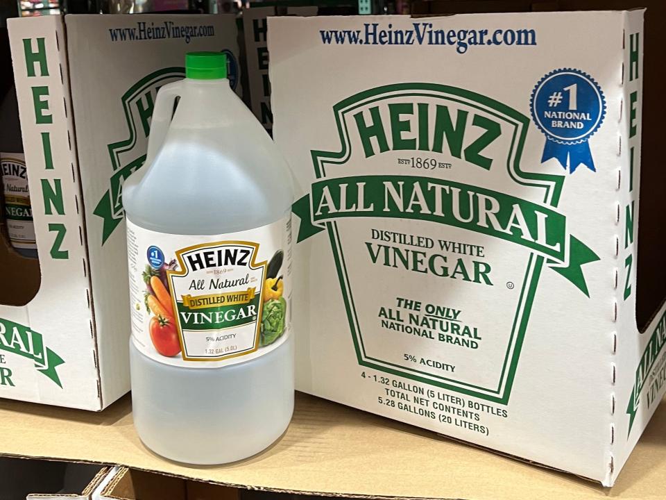 clear and white jug of heinz white vinegar on shelf at costco