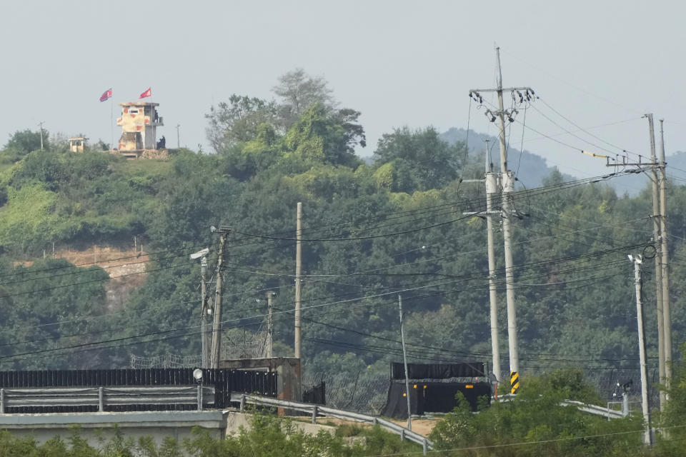 A military guard post of North Korea, left top, is seen in Paju, near the border with North Korea, South Korea, Friday, Sept. 24, 2021. North Korean leader Kim Jong Un’s powerful sister, Kim Yo Jong, said Friday, North Korea is willing to resume talks with South Korea if it doesn’t provoke the North with hostile policies and double standards.(AP Photo/Ahn Young-joon)