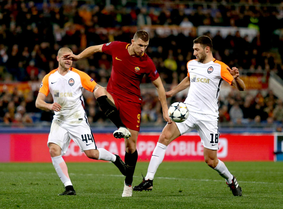 Edin Dzeko competes for the ball with Ivan Ordets and causes the Shakhtar Donetsk defence more problems.