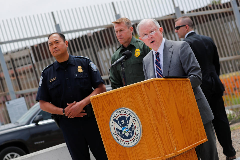 Attorney General Jeff Sessions holds a news conference next to the U.S.-Mexico border wall. (Photo: Mike Blake/Reuters)