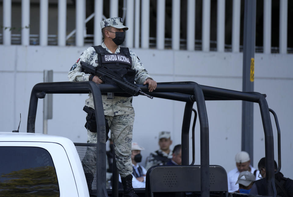 Security personnel guard the prosecutor's building where Ovidio Guzmán, one of the sons of former Sinaloa cartel boss Joaquin "El Chapo" Guzmán, is in custody in Mexico City, Thursday, Jan. 5, 2023. The Mexican military has captured Ovidio Guzman during a operation outside Culiacan, a stronghold of the Sinaloa drug cartel in western Mexico. (AP Photo/Fernando Llano)