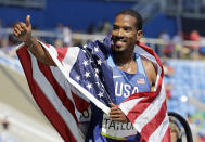 <p>United States’ Christian Taylor celebrates with the U.S. flag after winning the gold medal in the men’s triple jump final during the athletics competitions of the 2016 Summer Olympics at the Olympic stadium in Rio de Janeiro, Brazil, Tuesday, Aug. 16, 2016. (AP Photo/Charlie Riedel) </p>
