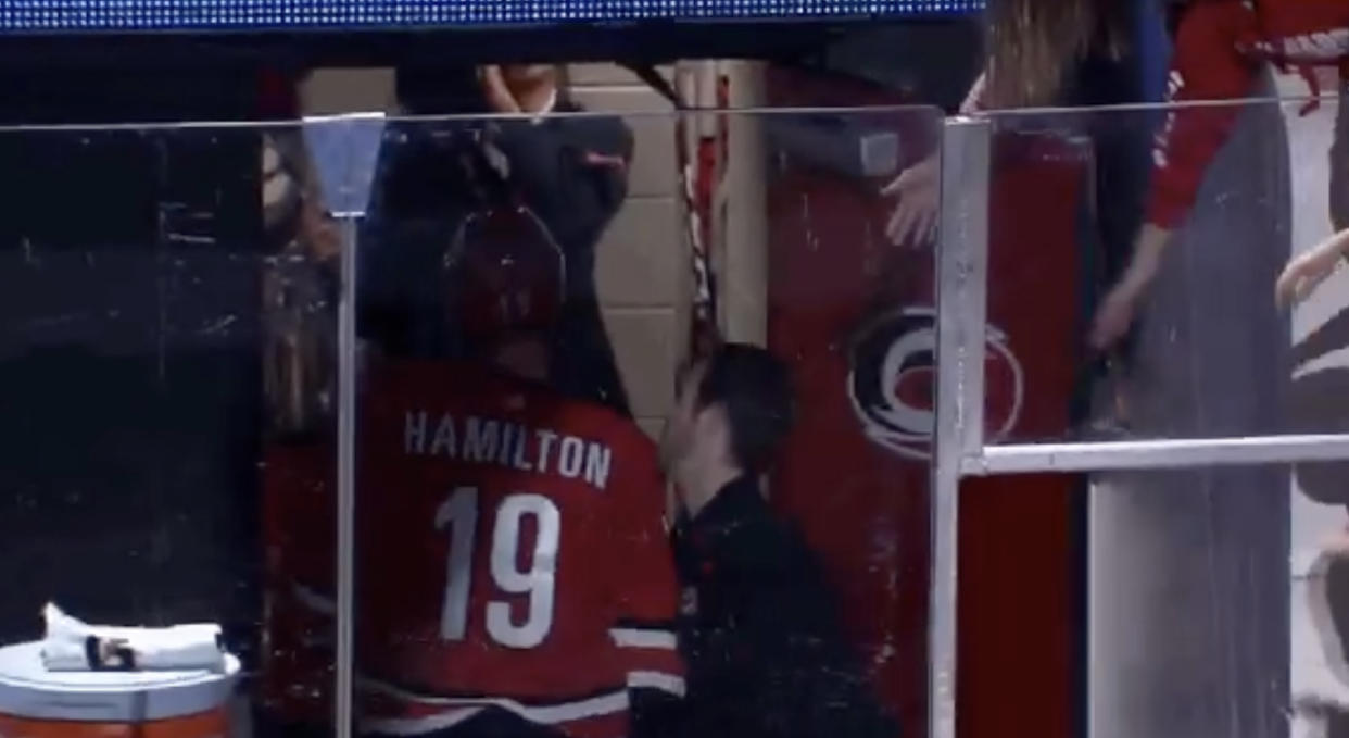 Carolina's Dougie Hamilton gives Patrick Budds a nut tap following the Hurricanes' 4-3 overtime win against the Tampa Bay Lightning on Sunday night. 