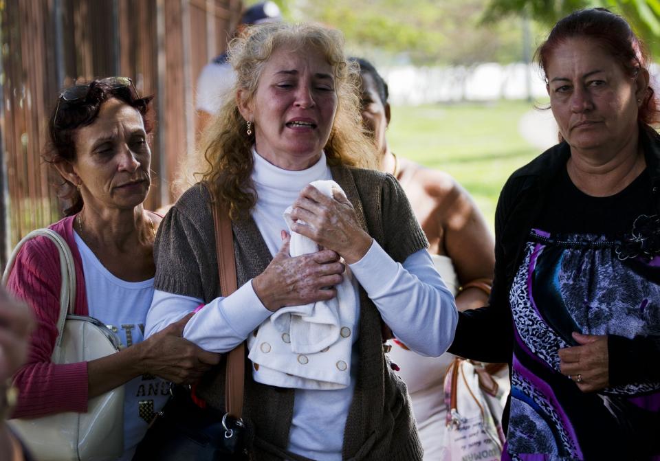 <p>Grieving relatives of passengers who perished in Cuba’s worst aviation disaster leave the morgue, in Havana, Cuba, Saturday, May 19, 2018. (Photo: Ramon Espinosa/AP) </p>